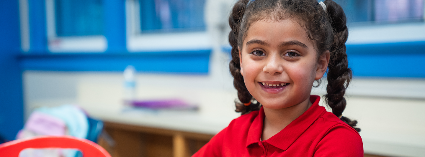 Young girl in pigtails smiling