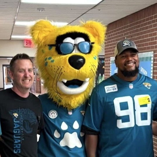 Mr. Hartley with Jaguars mascot and player