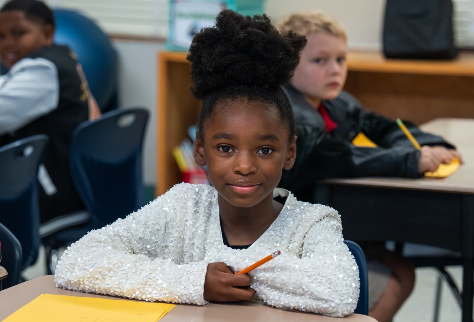 Student smiling at the camera