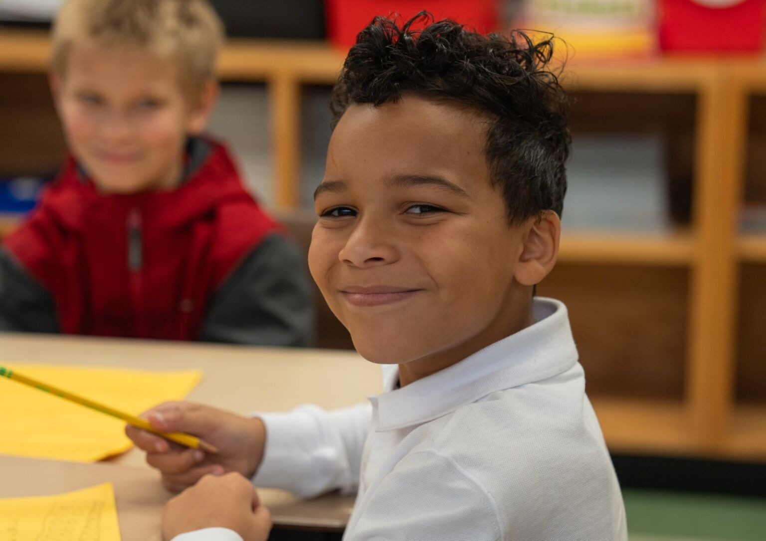 Student smiling at the camera