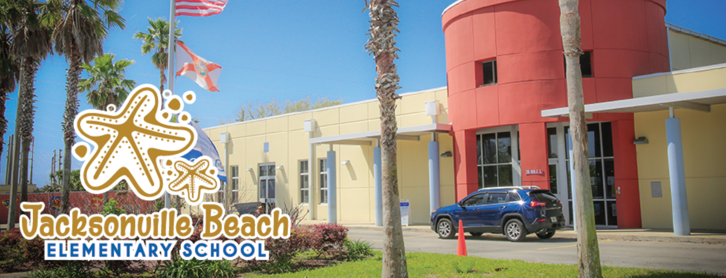 Image of the front of Jacksonville Beach Elementary with flags flying