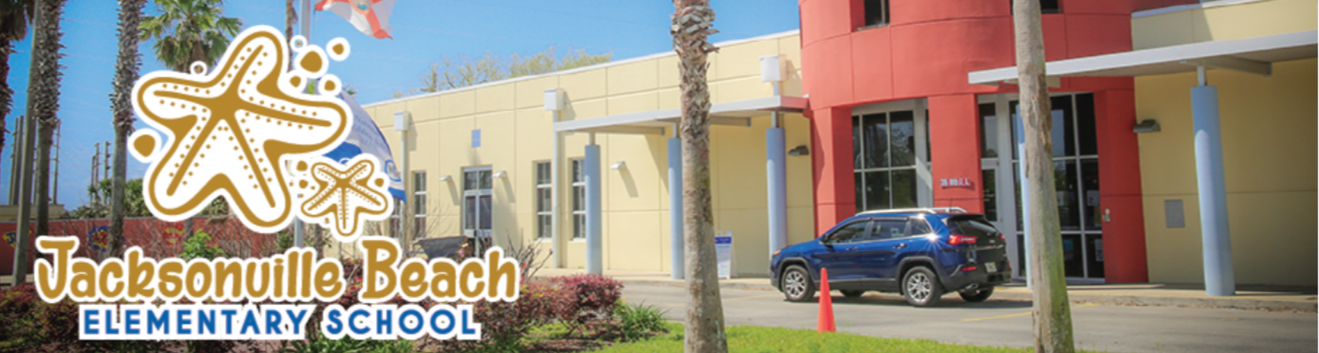 Image of the front of Jacksonville Beach Elementary with flags flying