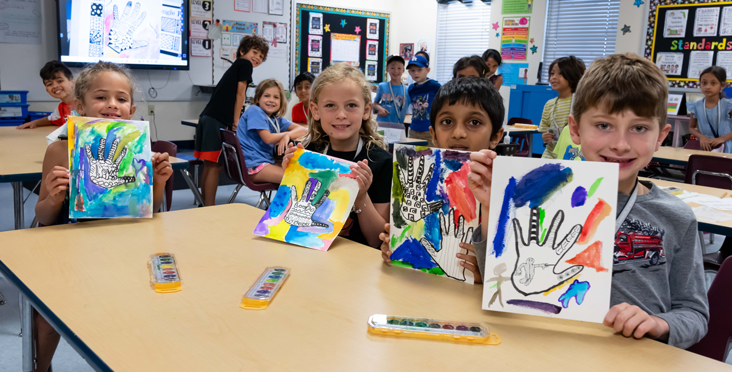 4 students painting hand picture