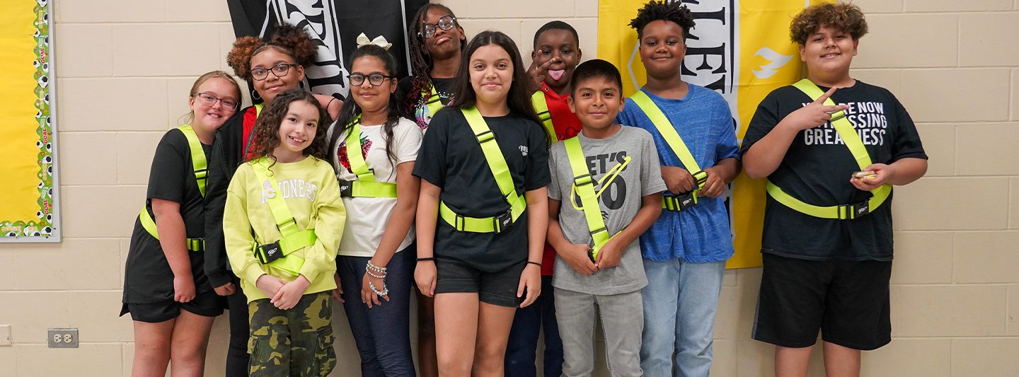 Group of students wearing safety belts