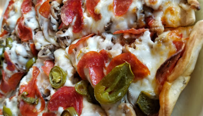 Pepperoni pizza with peppers and mushrooms 