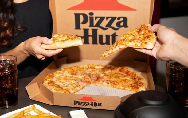 people sharing pizza hut cheese pizza from the box