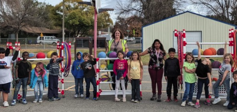 teacher with students in the school playground