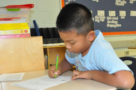 kid with pencil