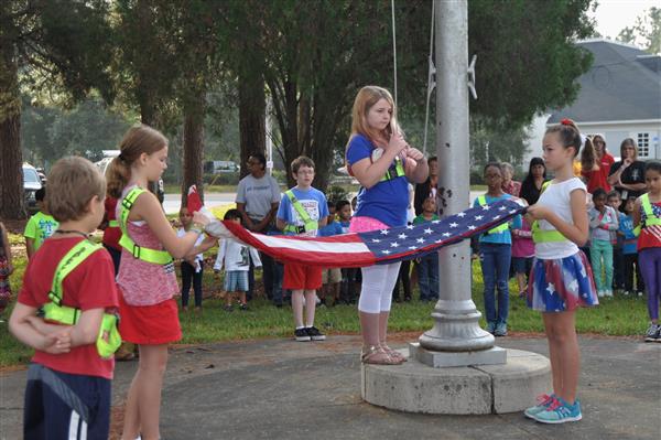 kids holding the USA flag