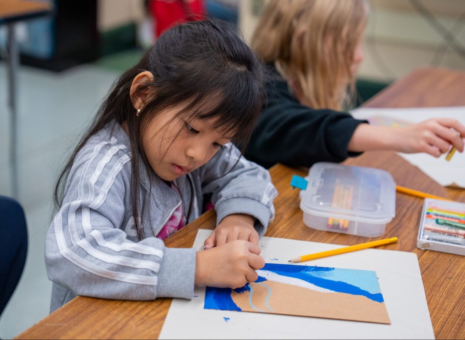 Student drawing a picture