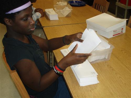 girl organizing papers