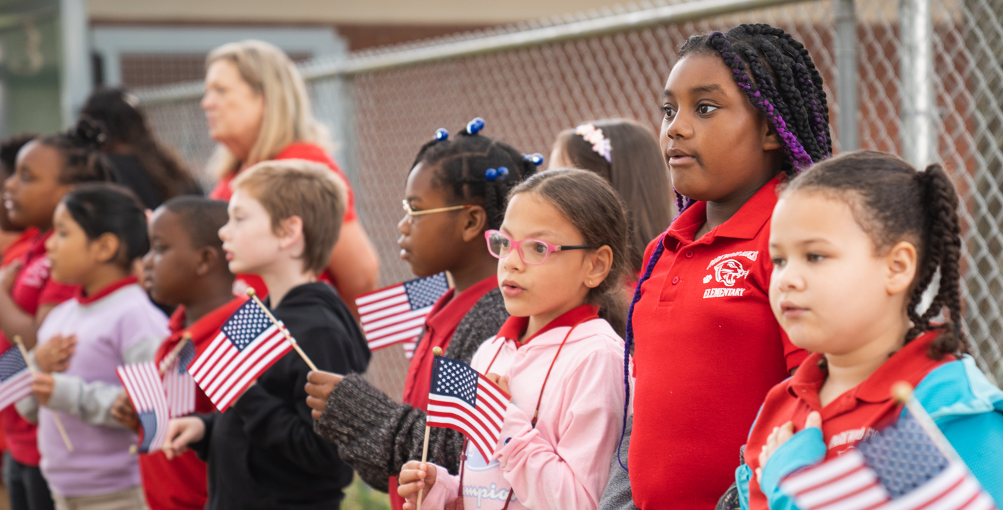 students holding flag