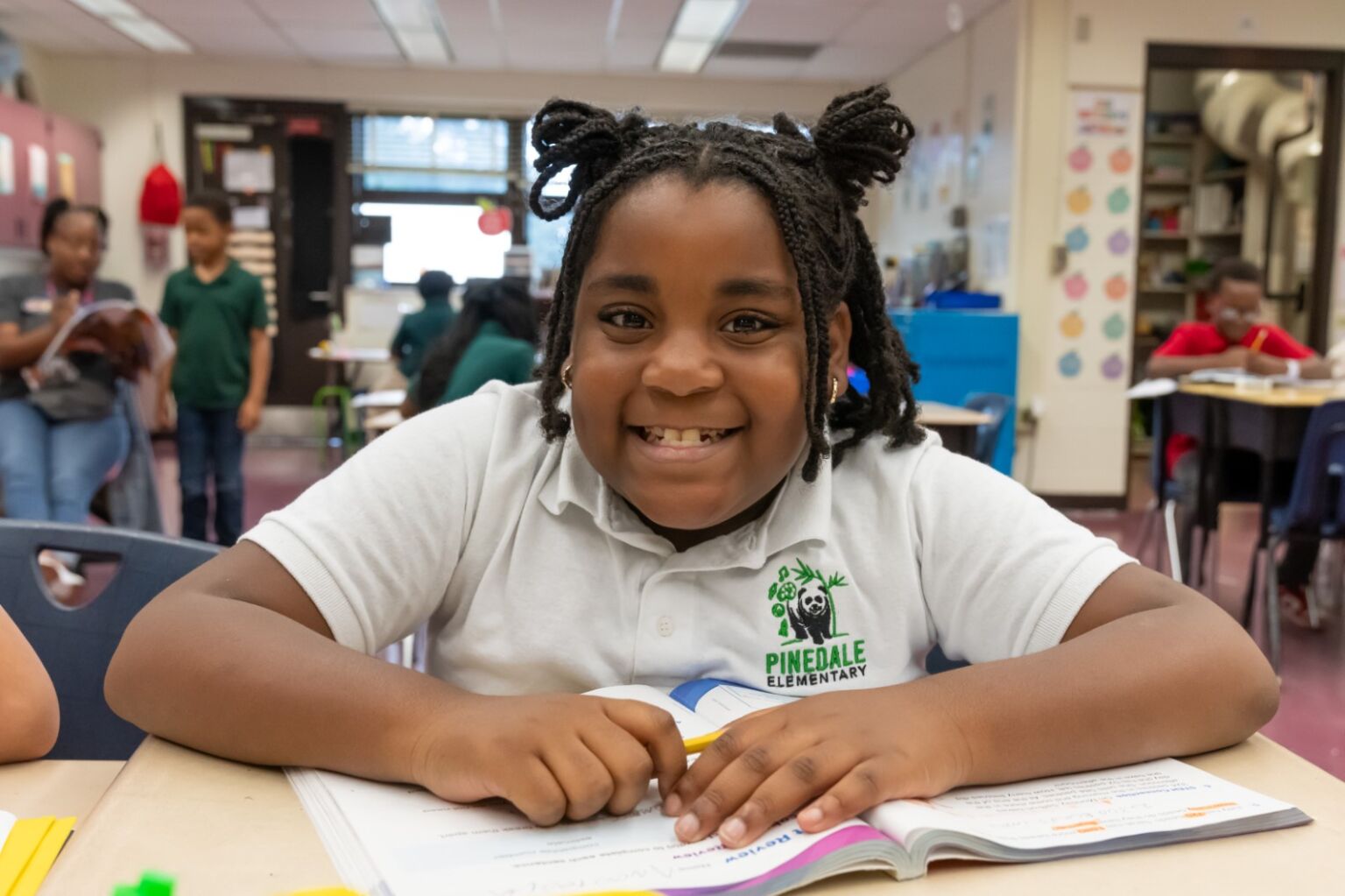 A student smiling at the camera