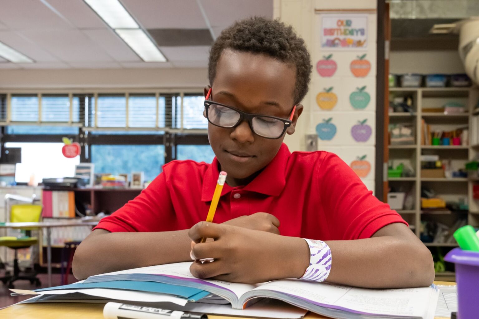 A student writing on his paper