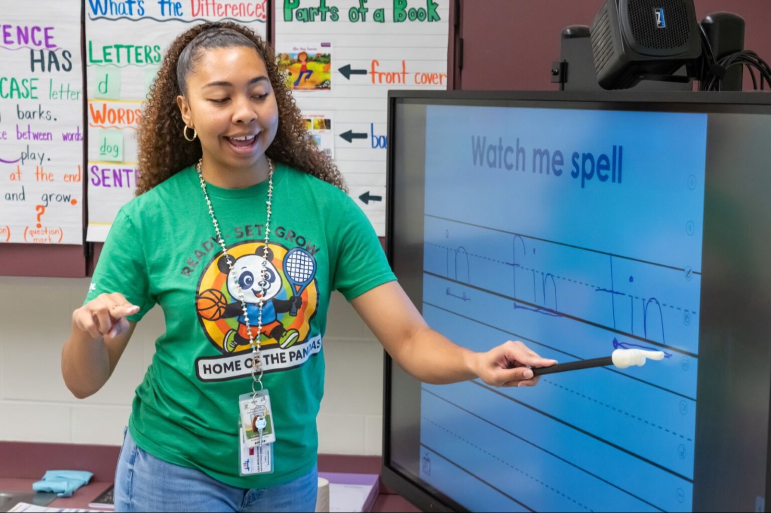 teacher teaching on a white board