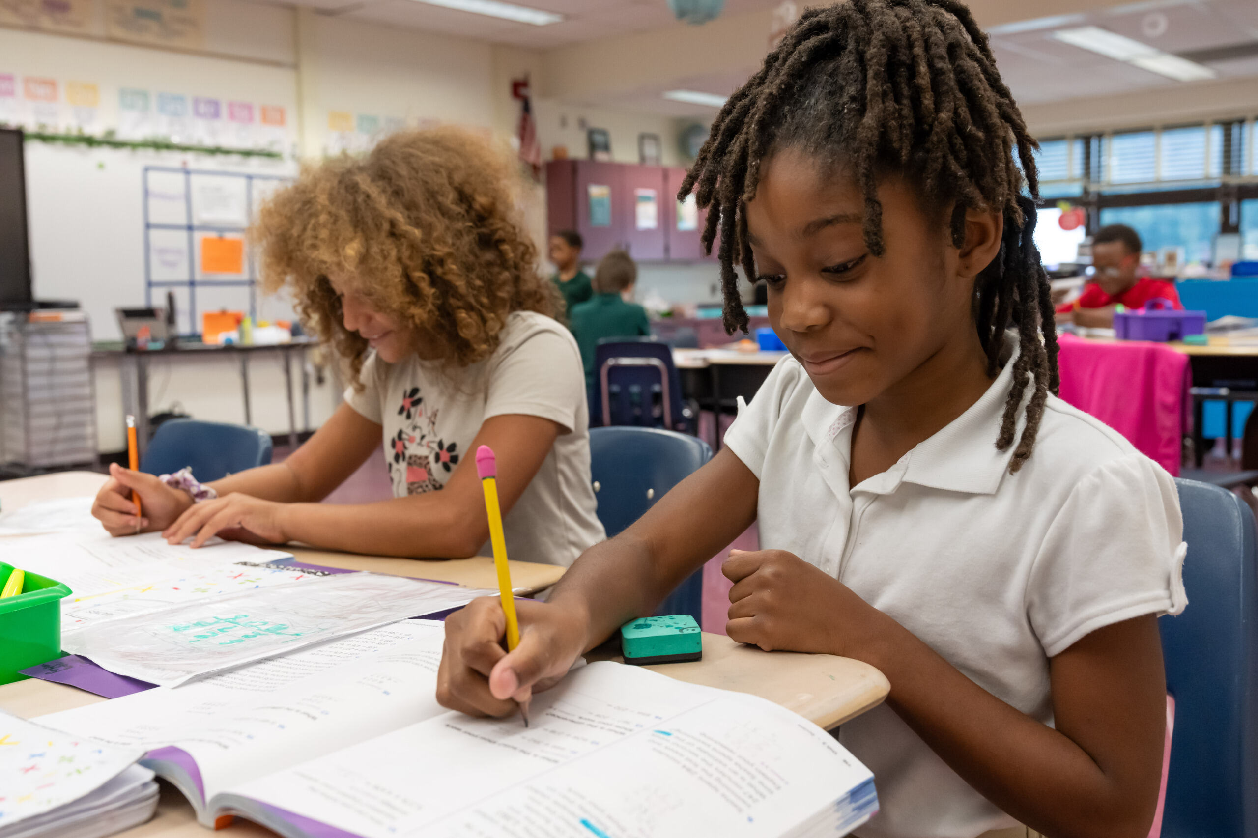 Student smiling while doing math