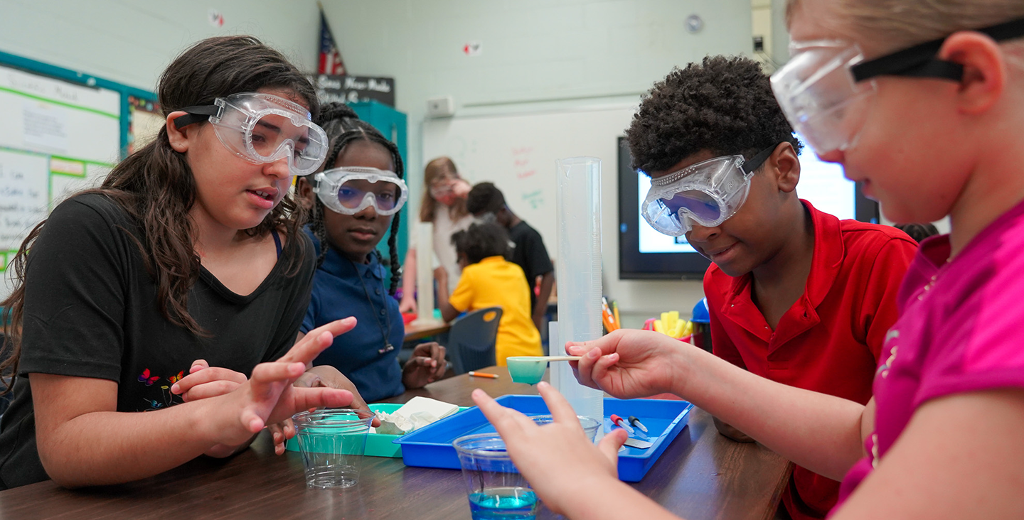 students working together on a science experiment