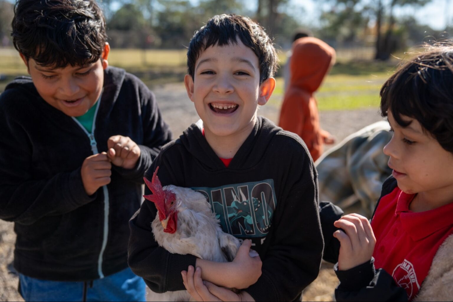 Student holding a chicken