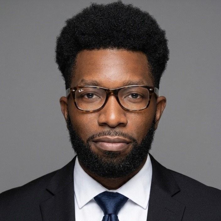 Headshot of Assistant Principal in a suit and tie