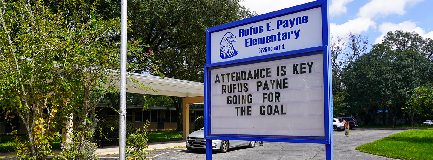 marquee at front of school building