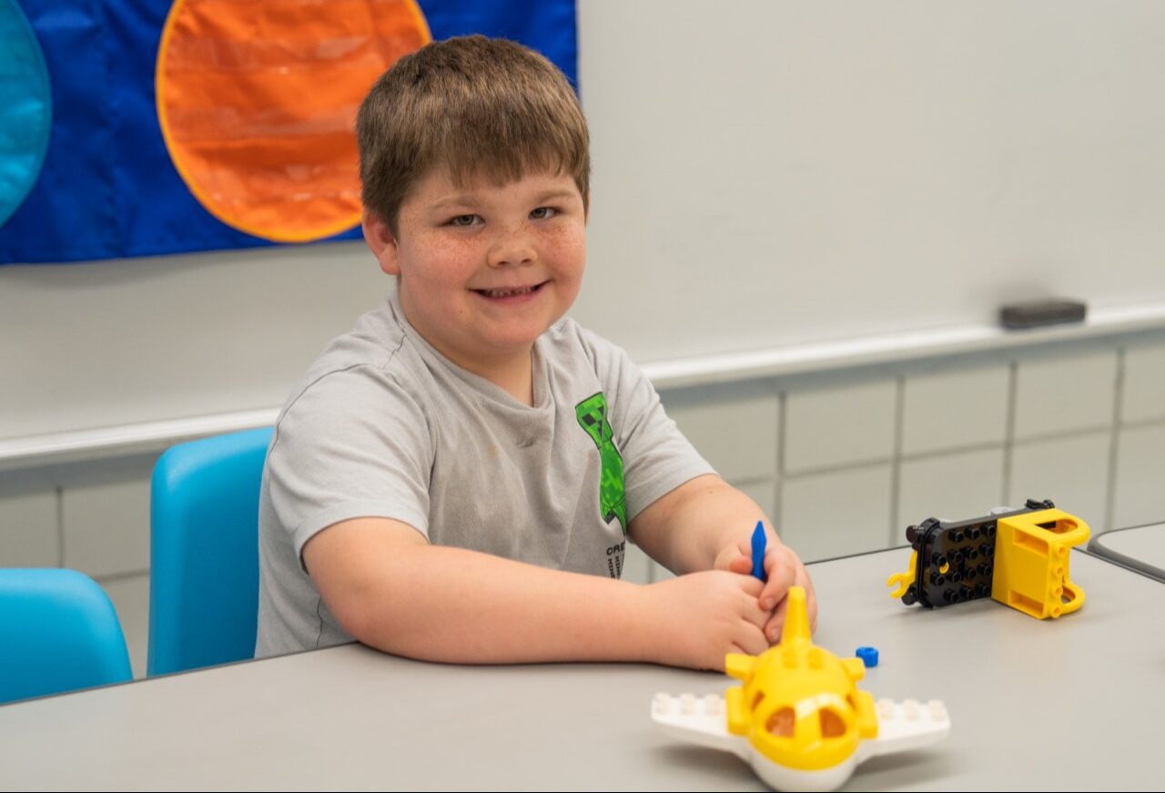Student smiling at the camera