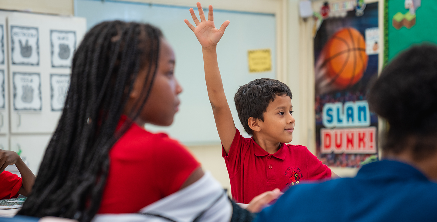 student raising hand