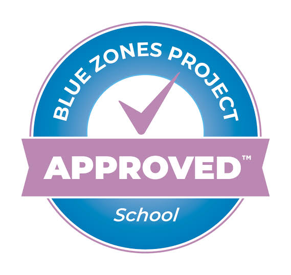 Blue Zones Project Approved School logo on a white background. A blue circle with a white checkmark and text.