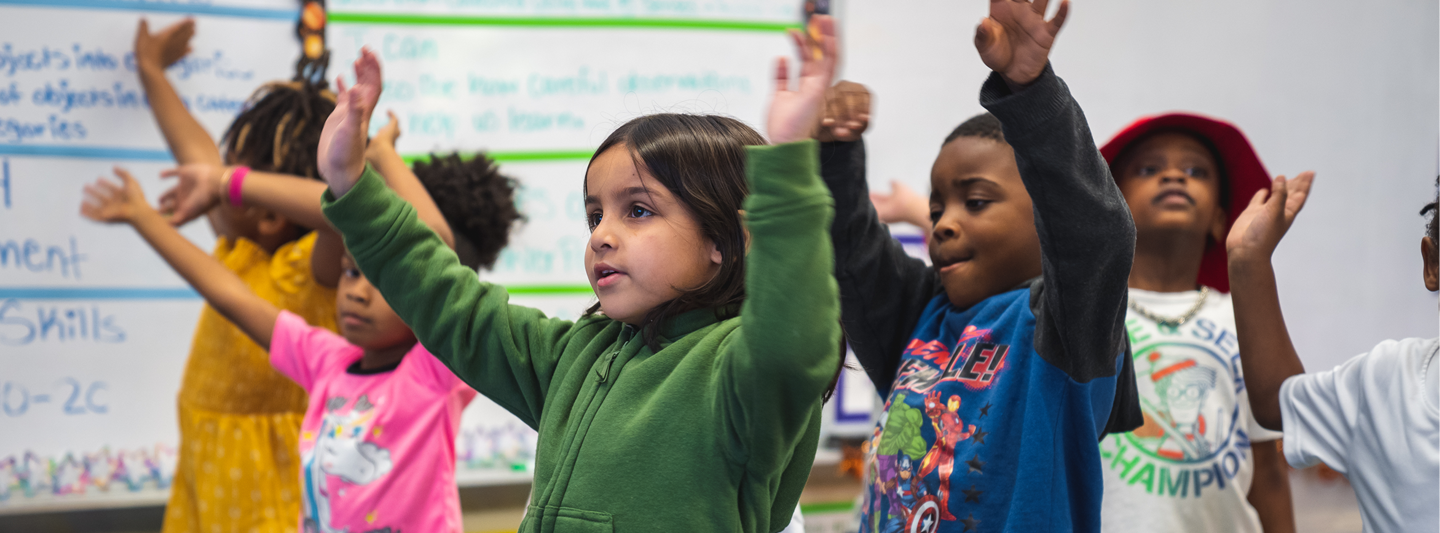 group of students dancing in class