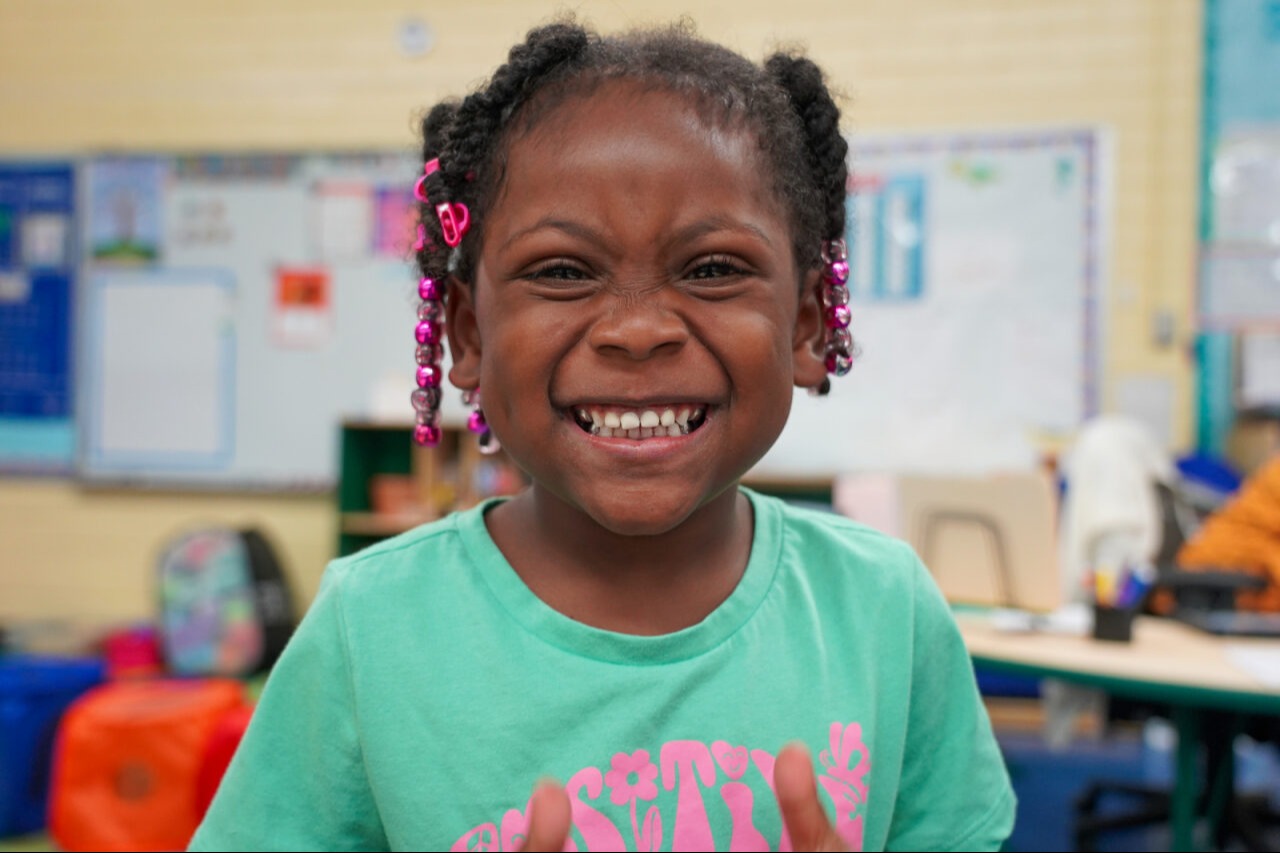 Student smiling at the camera