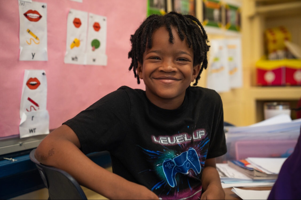 Student smiling at the camera