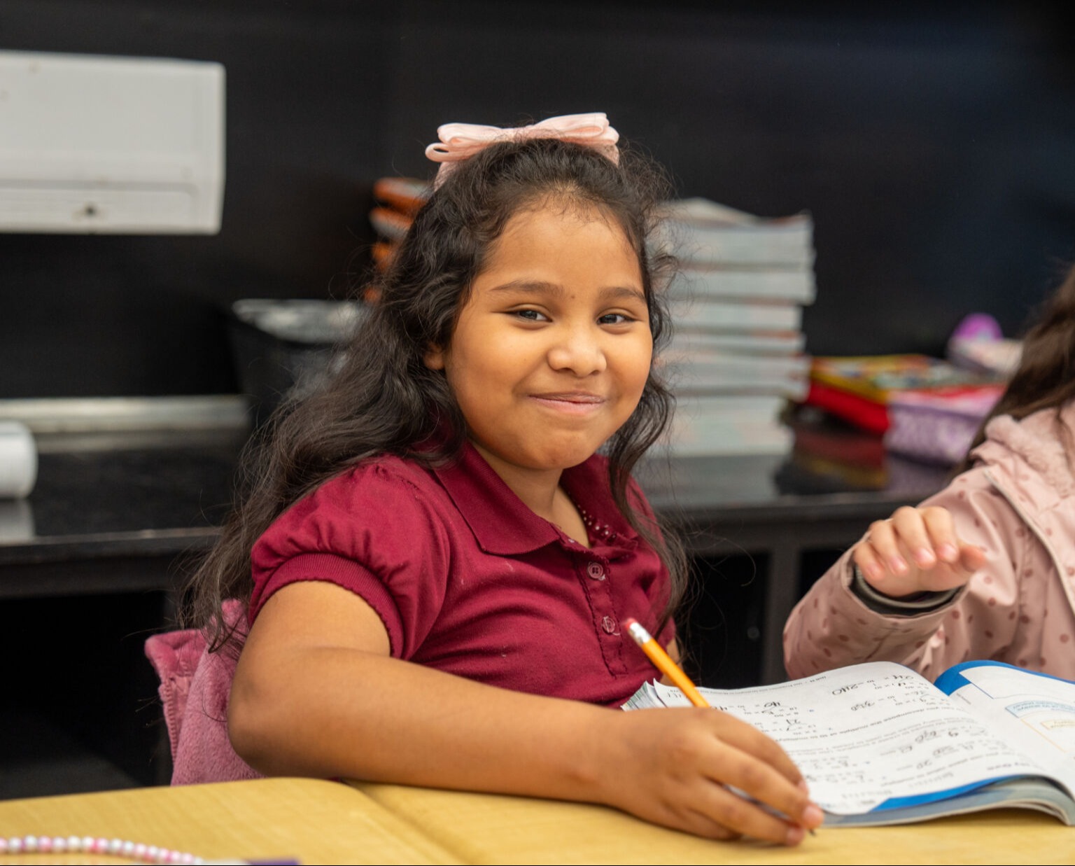 Student smiling at the camera