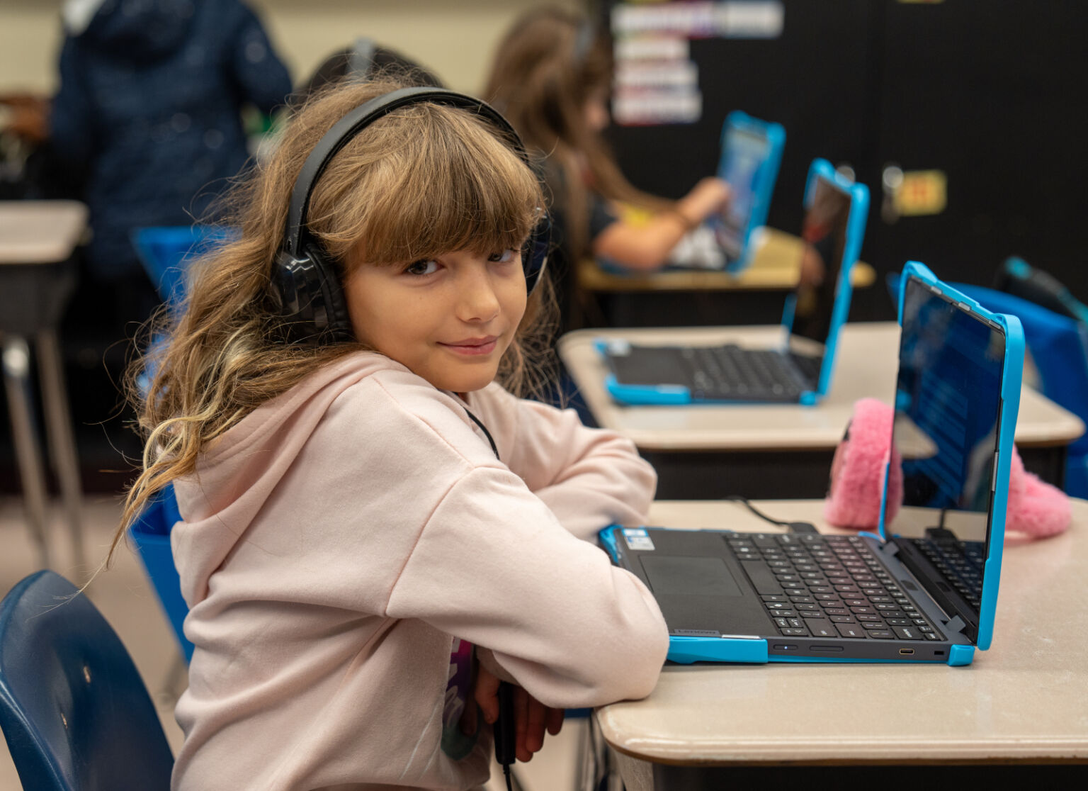 Student smiling at the camera