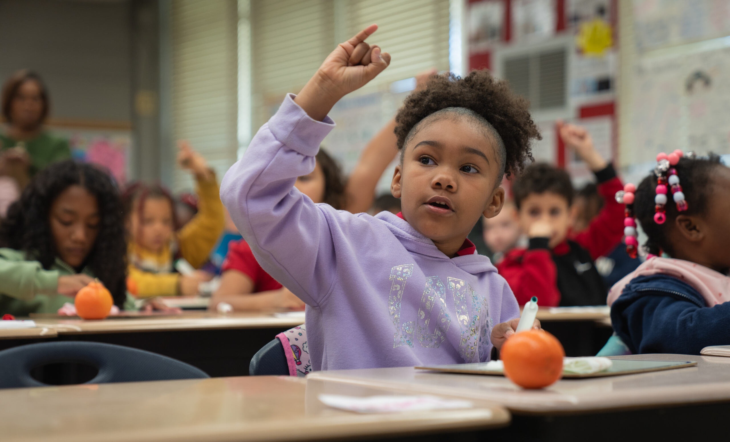 Student raising her hand