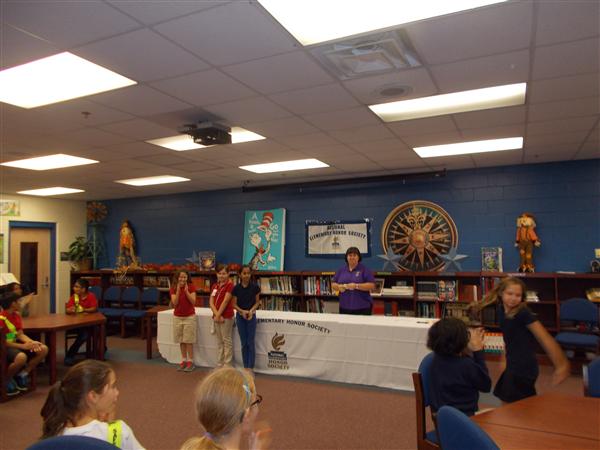 A lively classroom scene with students and teachers.