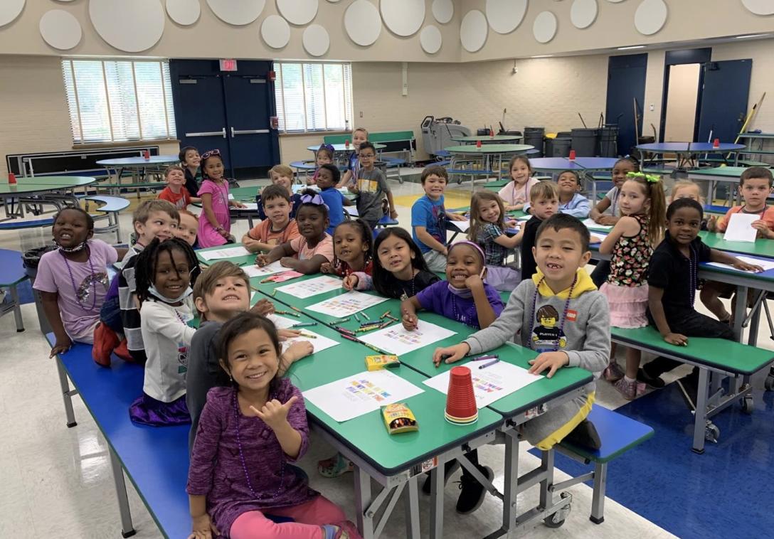 students in the classroom smiling