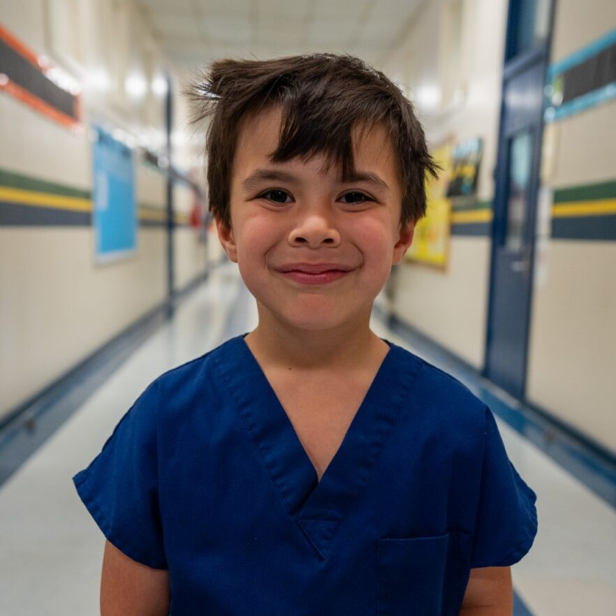 Student smiling at the camera