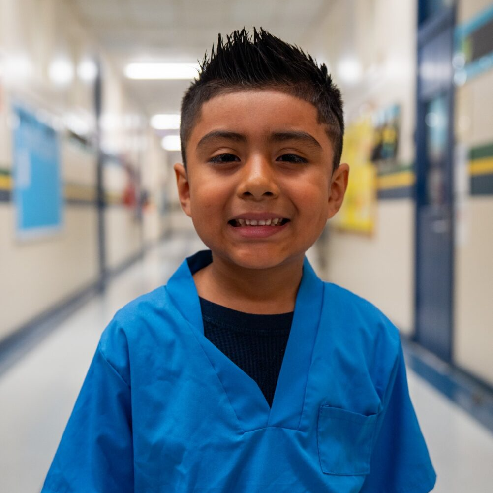 Student smiling at the camera