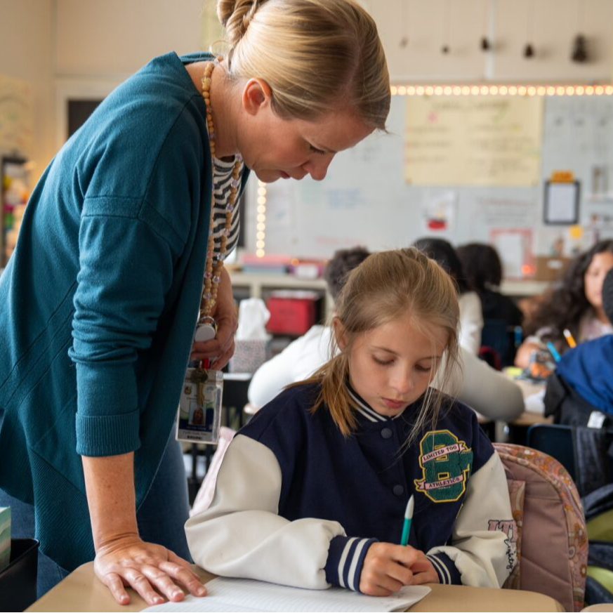 A teacher helping a student