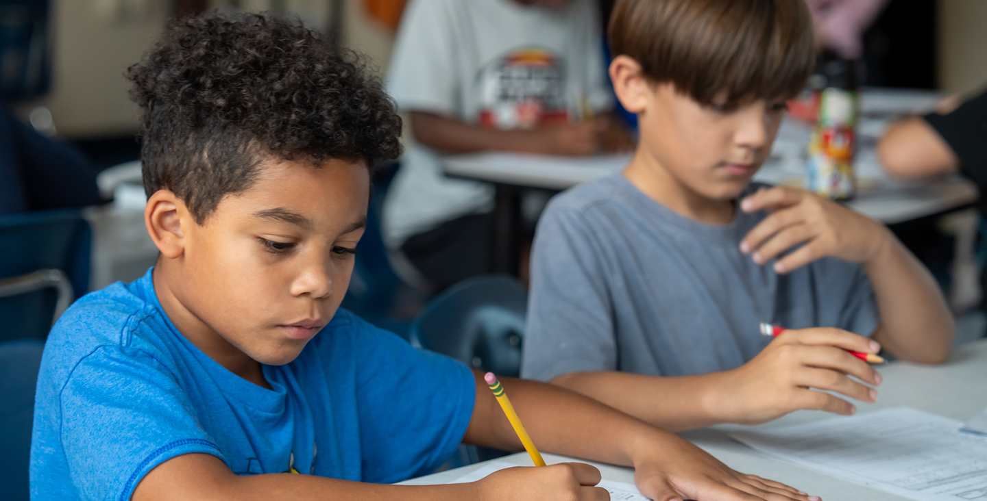2 students writing