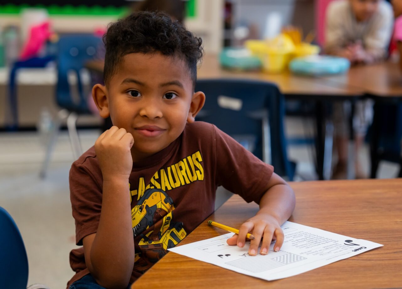Student smiling at the camera