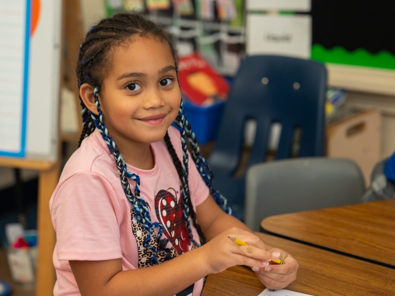 Student smiling at the camera