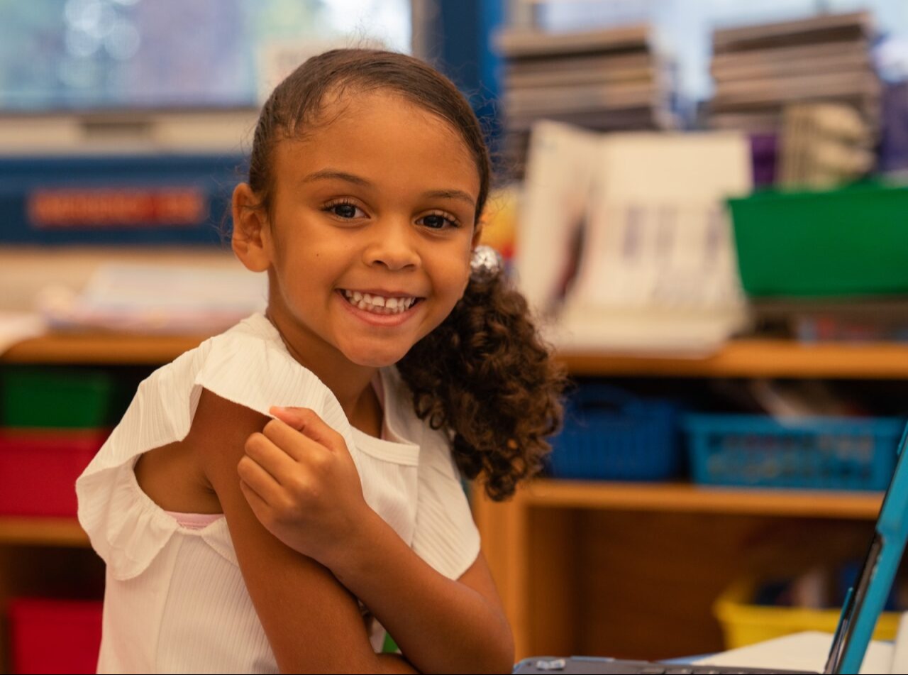 Student smiling at the camera