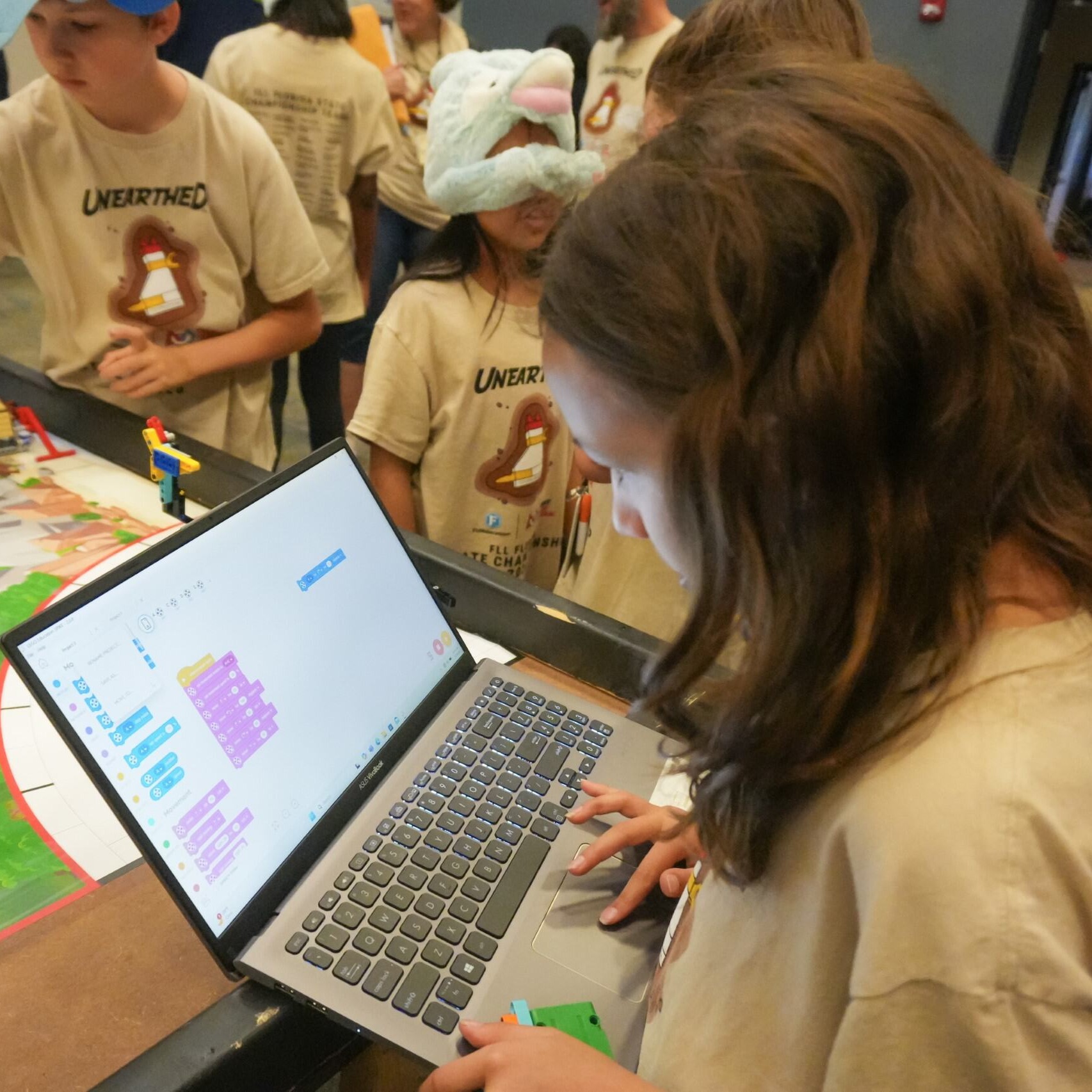 Student on a laptop coding