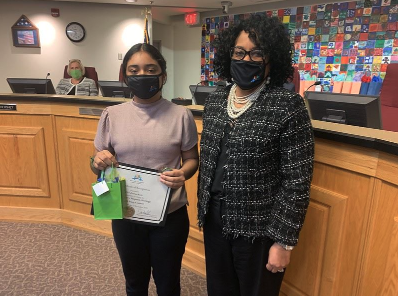 student and school staff wearing a face mask