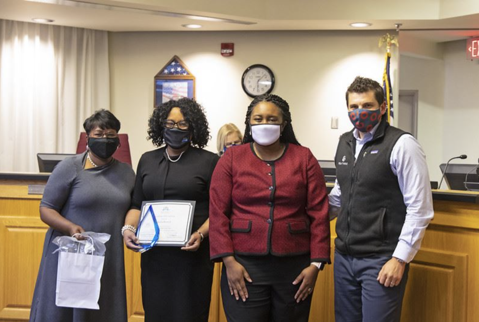 school staff wearing face masks and smiling