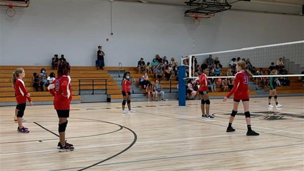 students playing volleyball