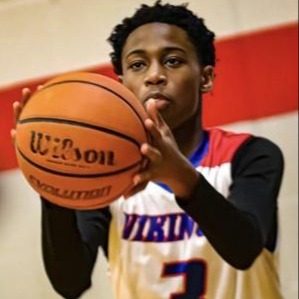 student holding a basketball 