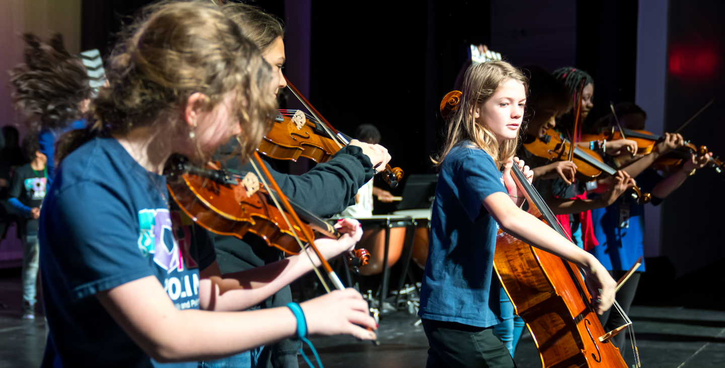 Kids playing the violin and cello