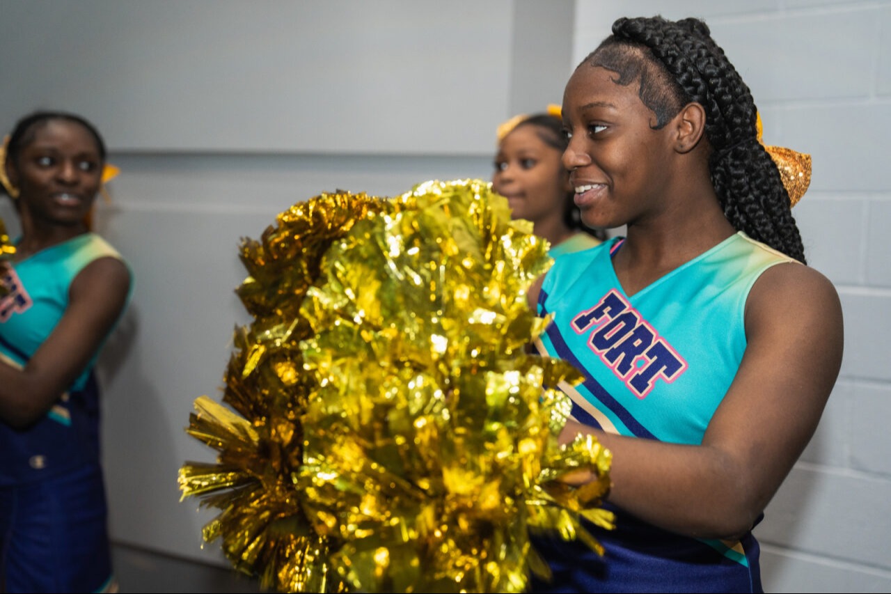 A cheerleader cheering