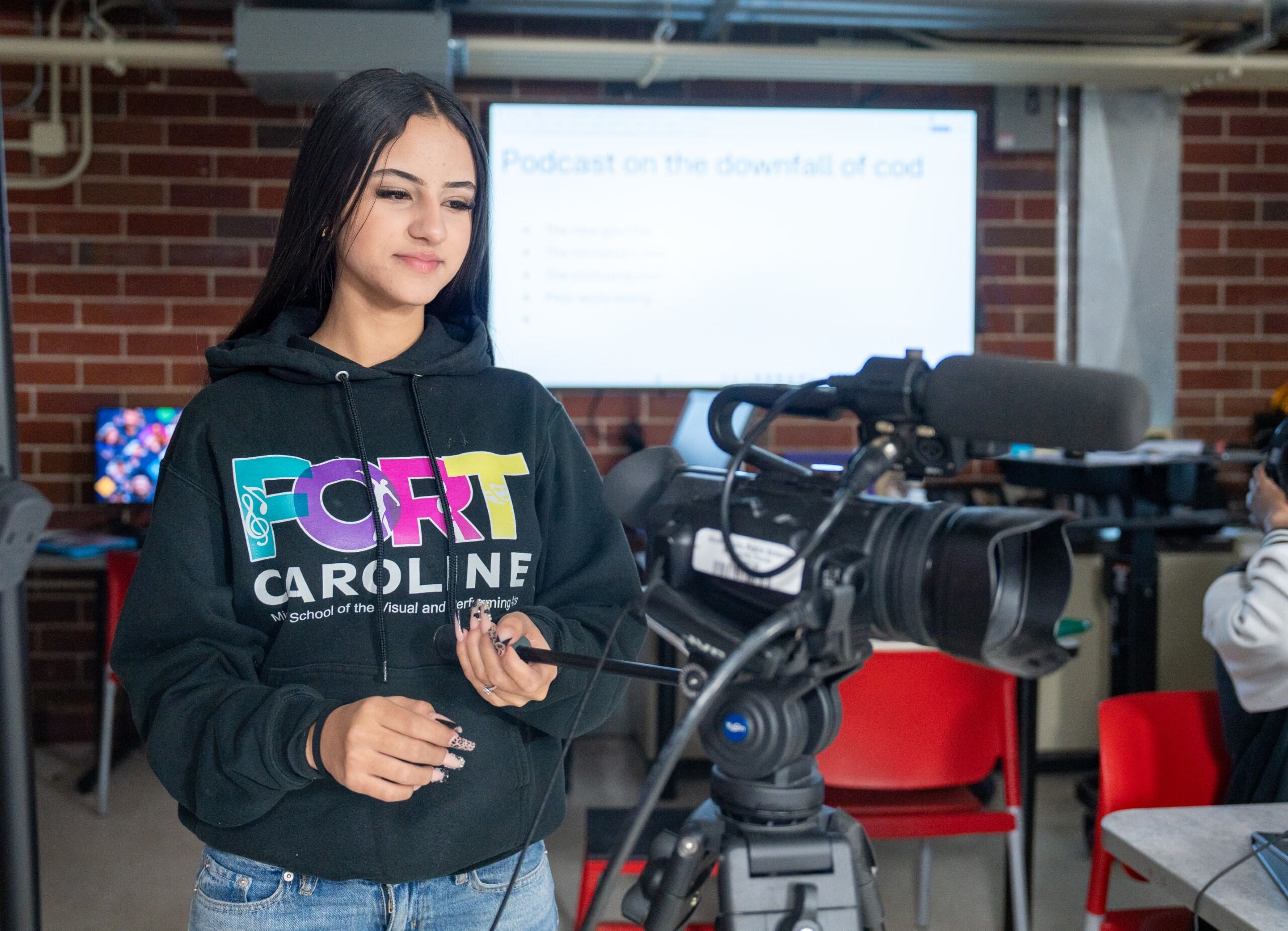 A student using a film camera
